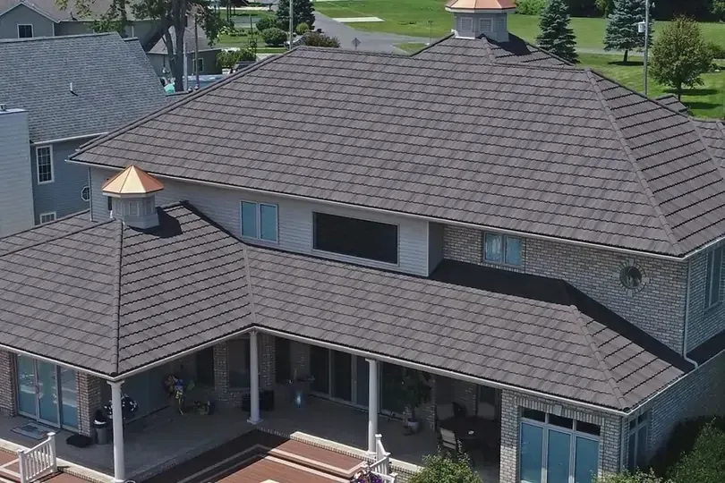 Aerial view of a modern home with a textured gray roof Aerial view of a modern home with a textured gray roof