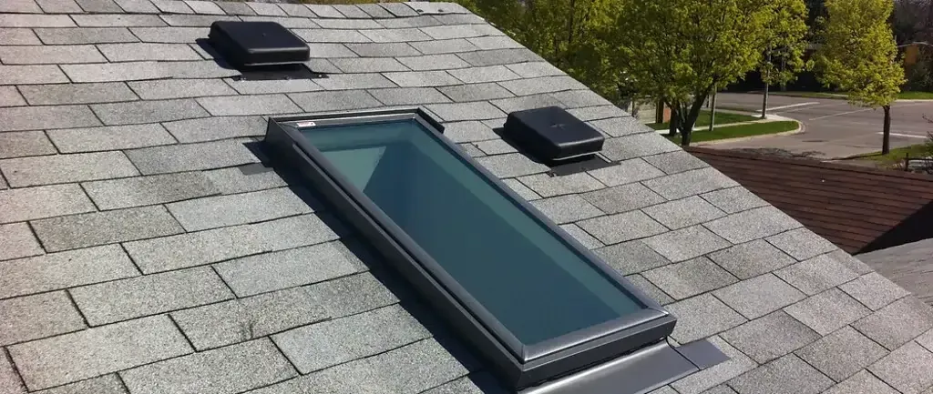 Roof with skylight and two ventilation units Roof with skylight and two ventilation units