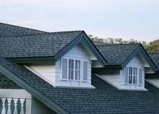 Two gabled windows on a sloped roof Two gabled windows on a sloped roof