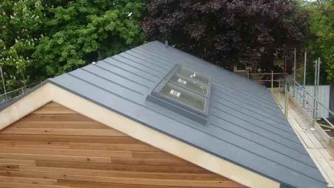 modern sloped roof with gray metal sheeting and skylights modern sloped roof with gray metal sheeting and skylights