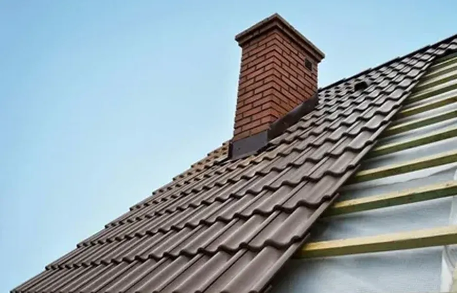A close up view of a tiled roof featuring a brick chimney A close-up view of a tiled roof featuring a brick chimney