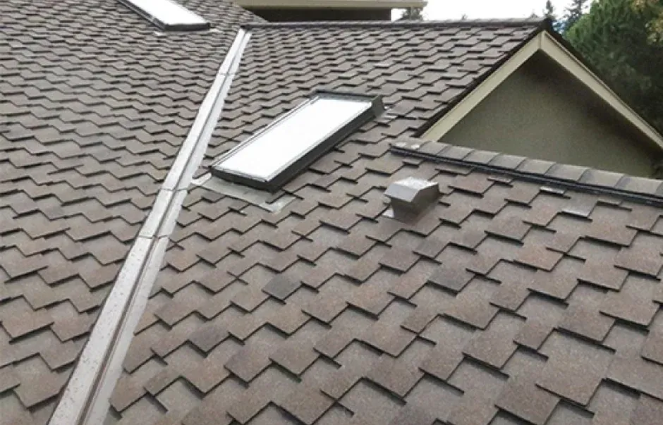 Close up of a sloped roof with textured shingles Close-up of a sloped roof with textured shingles
